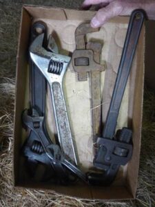 LOT 117 BOX OF CRESCENT WRENCHES & PIPE WRENCHES