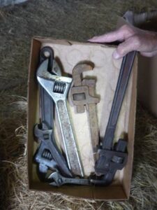 LOT 117 BOX OF CRESCENT WRENCHES & PIPE WRENCHES