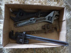 LOT 117 BOX OF CRESCENT WRENCHES & PIPE WRENCHES