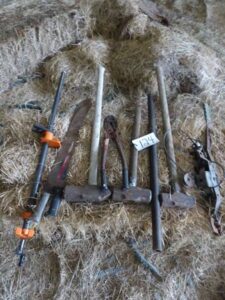 LOT 124 3 SLEDGE HAMMERS, 2 MATCHETS, PIPE CLAMPS 3 SLEDGE HAMMERS, 2 MATCHETS, PIPE CLAMPS, & BOLT CUTTER