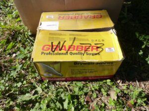 LOT 73 2 BOXES OF MISC METAL SCREWS &  7/16" PLYWOOD CLAMPS