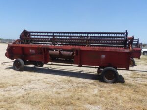 LOT 5883 CASE 1010 20 FT GRAIN PLATFORM WITH HEADER TRAILER 
